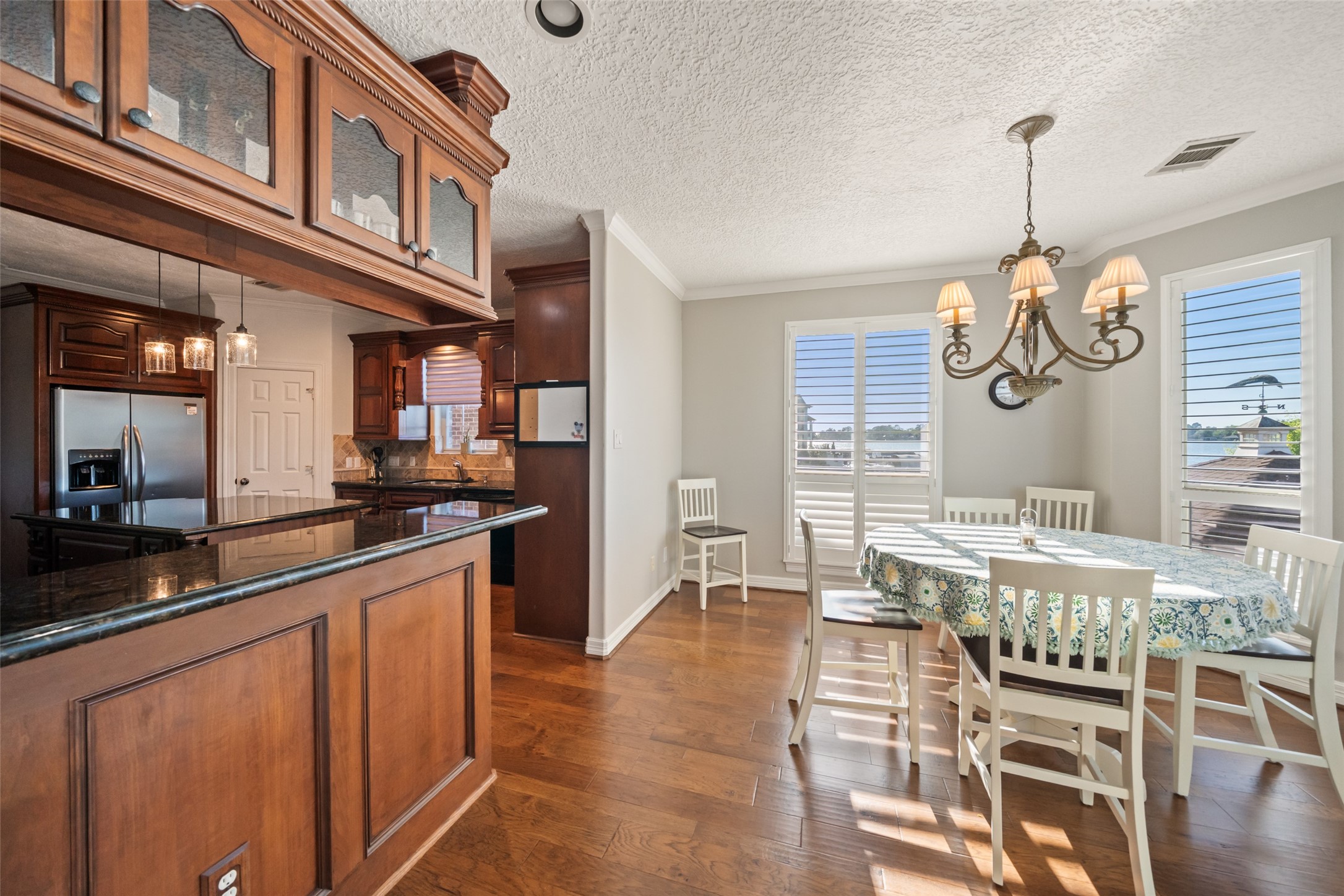 12200 Pebble View Drive Conroe, TX 77304 - Photo 13 of 43 a kitchen with stainless steel appliances granite countertop a stove and cabinets