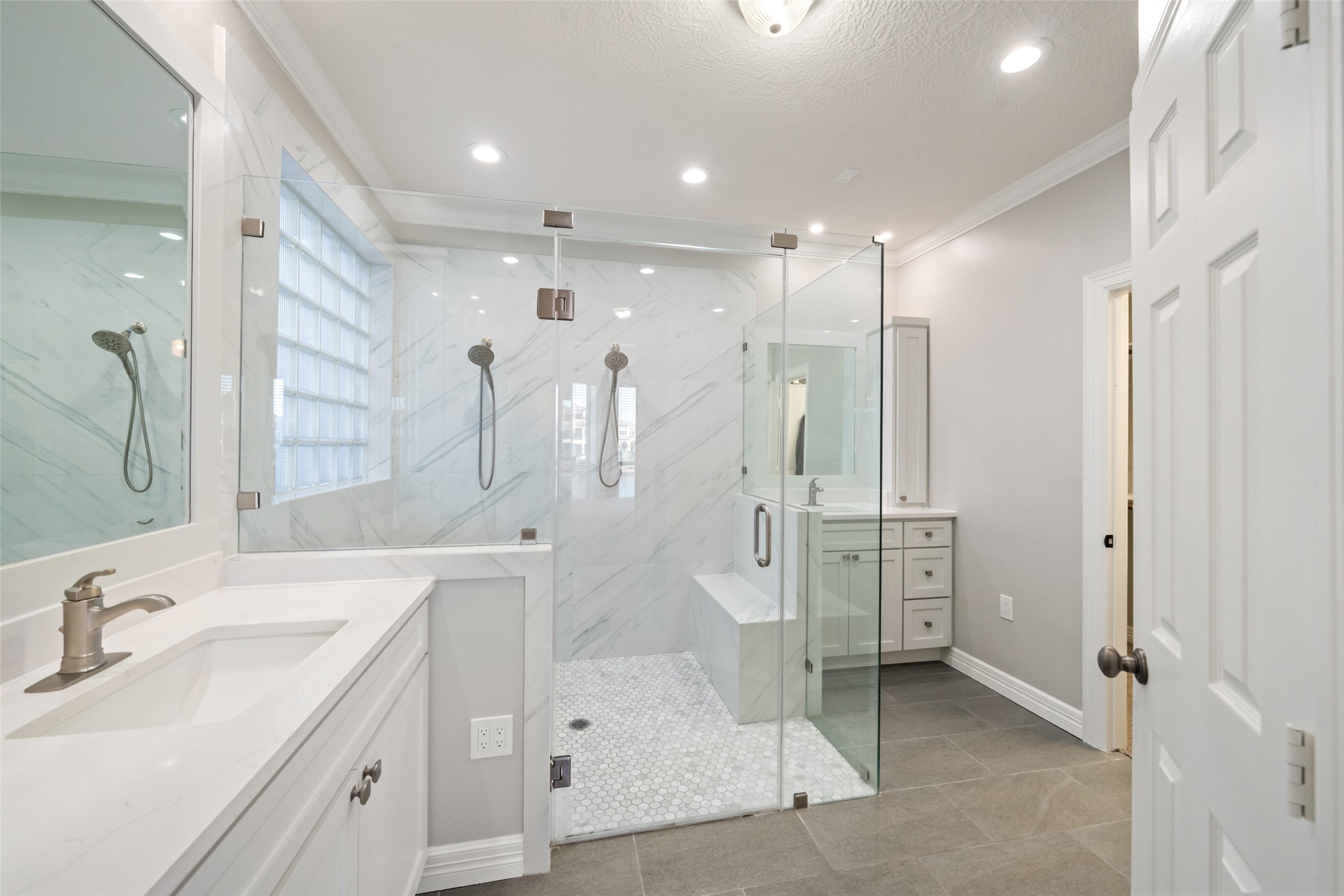 12200 Pebble View Drive Conroe, TX 77304 - Photo 15 of 43 a bathroom with a double vanity sink mirror and shower