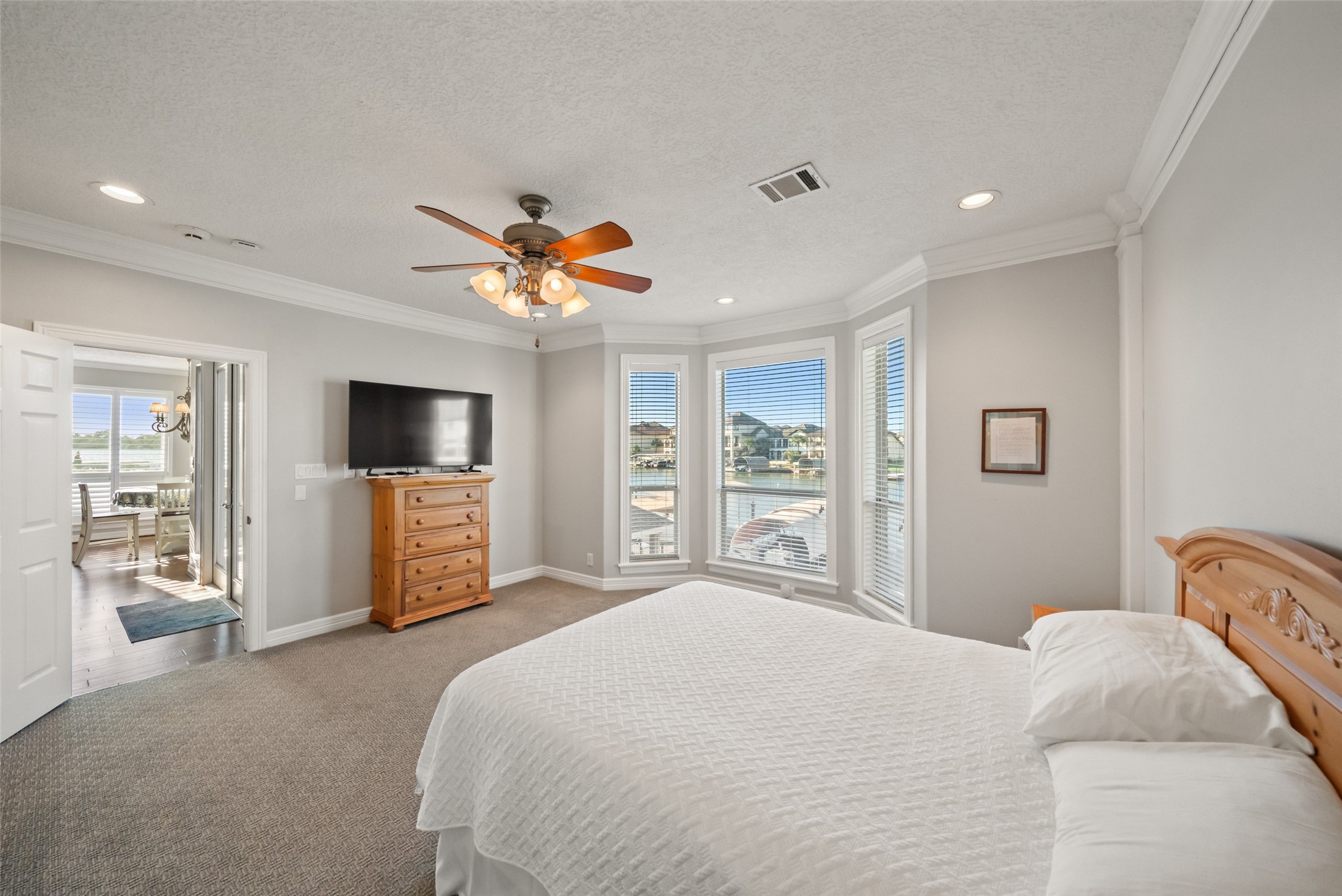 12200 Pebble View Drive Conroe, TX 77304 - Photo 16 of 43 a bedroom with a bed and a flat screen tv