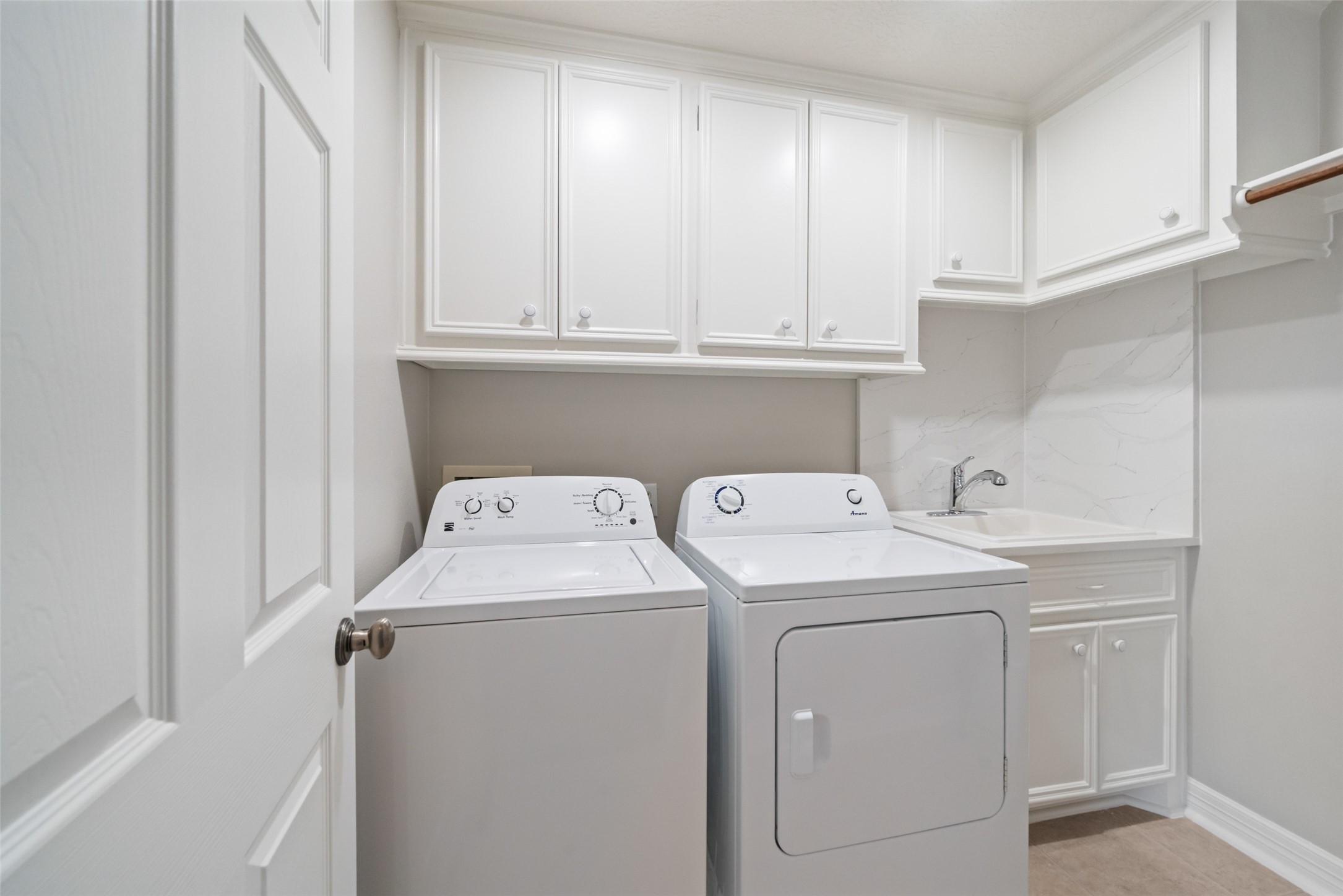 12200 Pebble View Drive Conroe, TX 77304 - Photo 25 of 43 a view of storage and utility room with washer and dryer