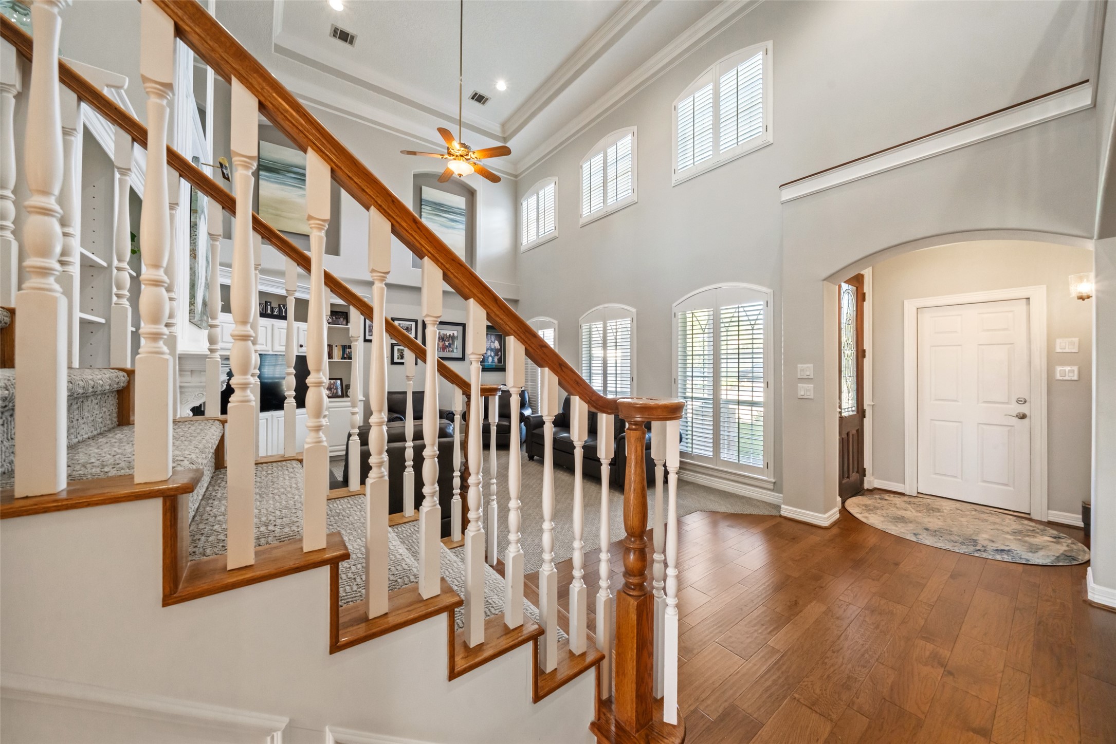 12200 Pebble View Drive Conroe, TX 77304 - Photo 3 of 43 a view of staircase with lots of frames and couches