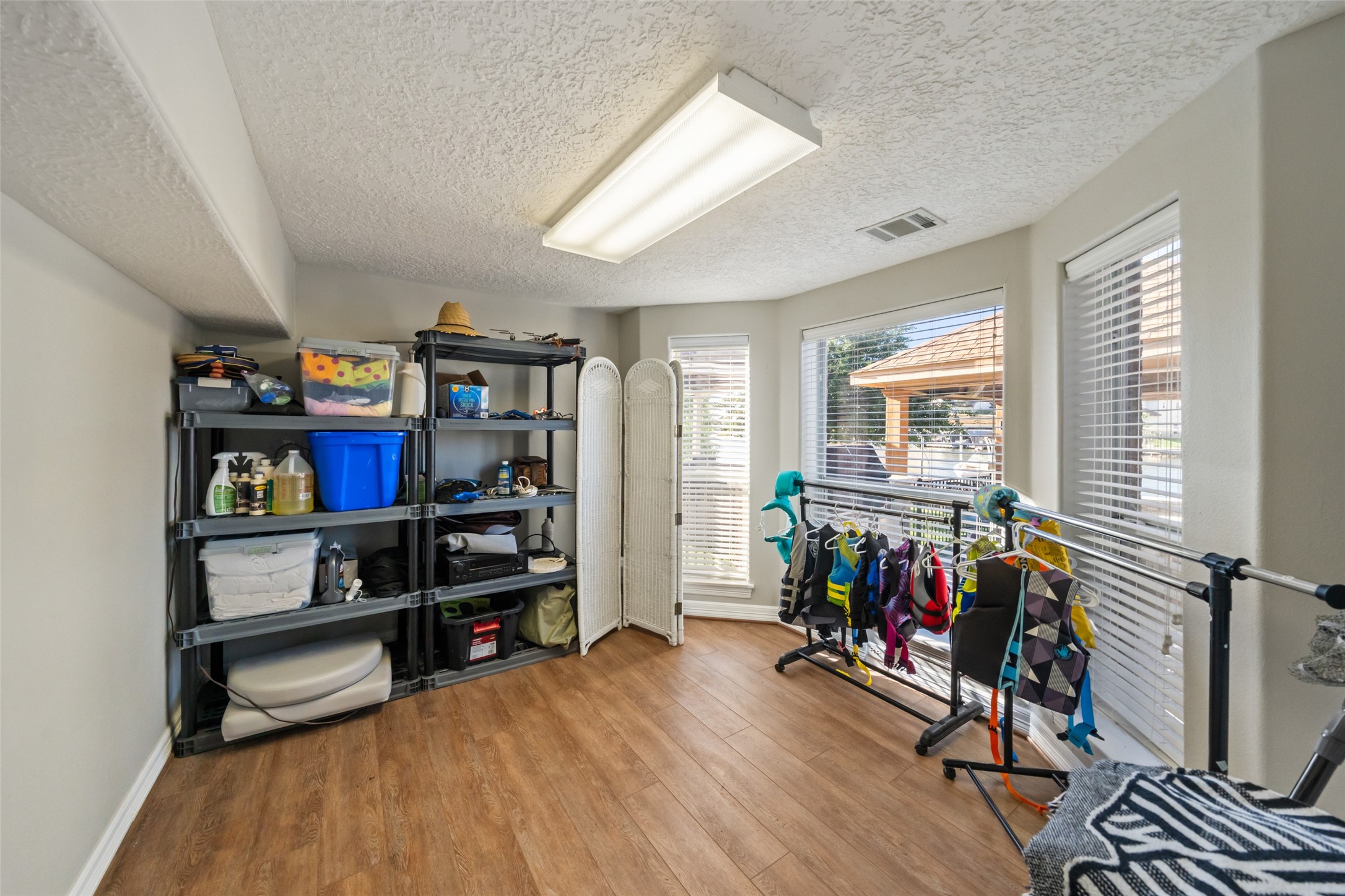 12200 Pebble View Drive Conroe, TX 77304 - Photo 33 of 43 a view of a workspace with furniture and a window