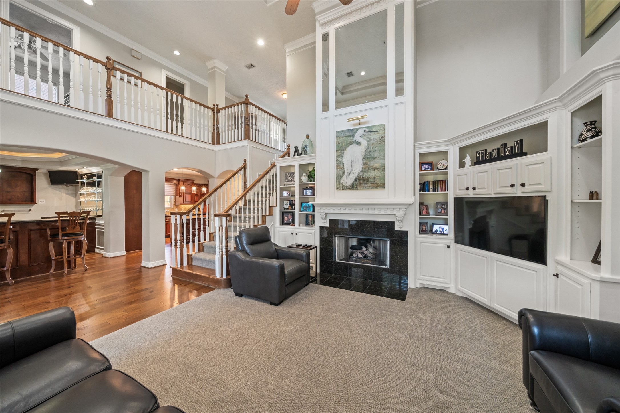 12200 Pebble View Drive Conroe, TX 77304 - Photo 6 of 43 a living room with furniture a fireplace and a flat screen tv
