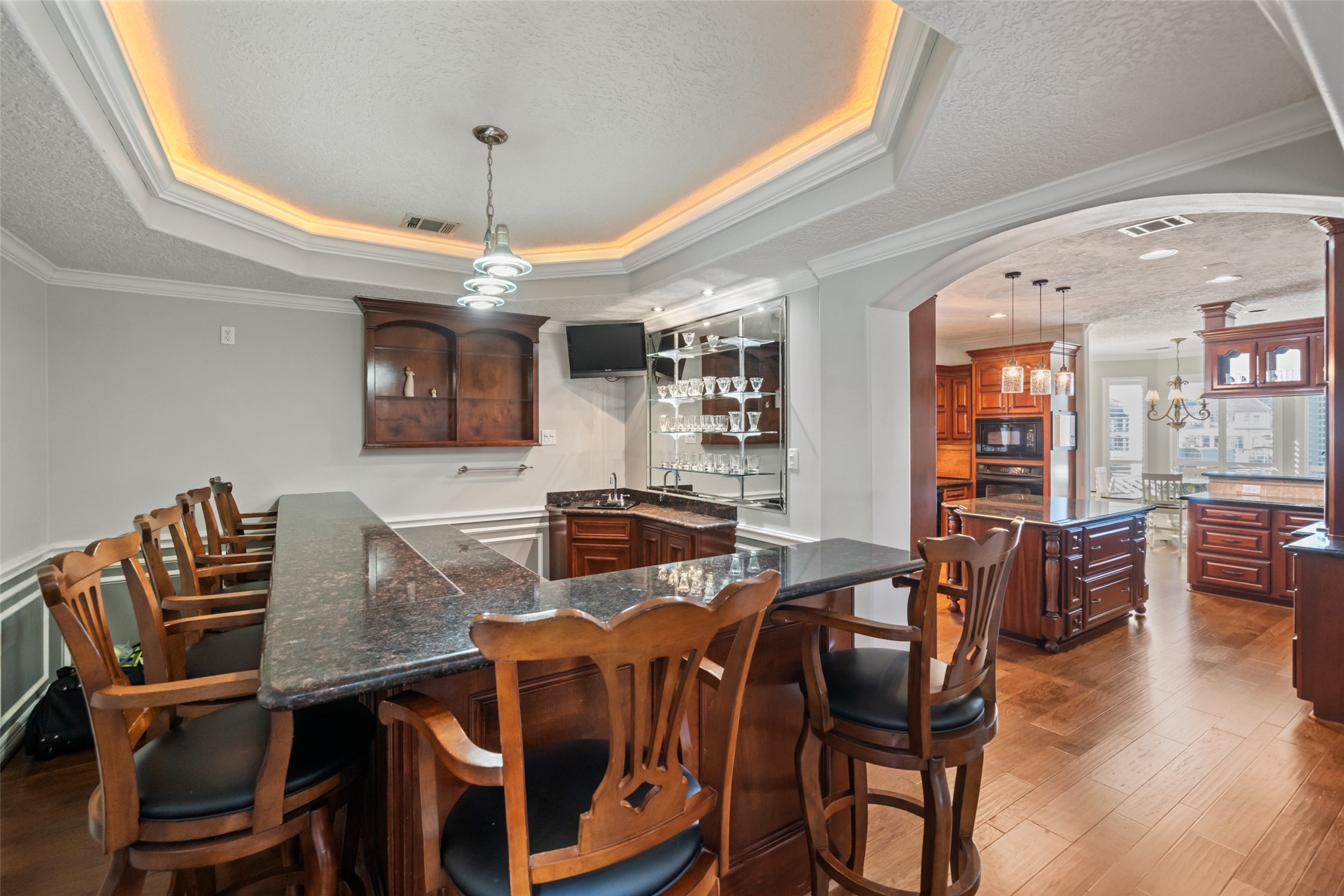 12200 Pebble View Drive Conroe, TX 77304 - Photo 7 of 43 a view of a dining room with furniture and wooden floor