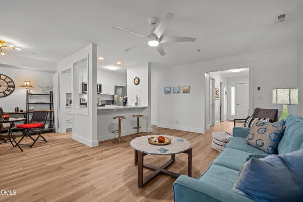 a kitchen with stainless steel appliances a refrigerator and a stove top oven