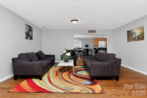 a living room with furniture and a rug