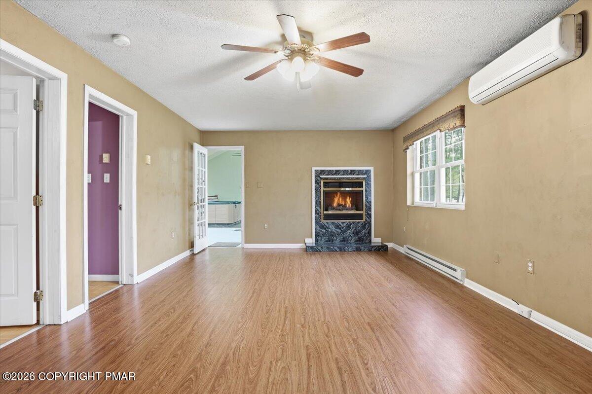 349 Bumble Bee Pass Cresco, PA 18326 - Photo 19 of 31 Family rm w/ fireplace and mini split