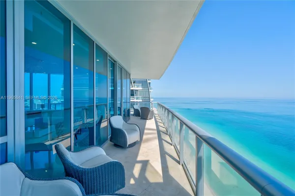 a balcony with chairs