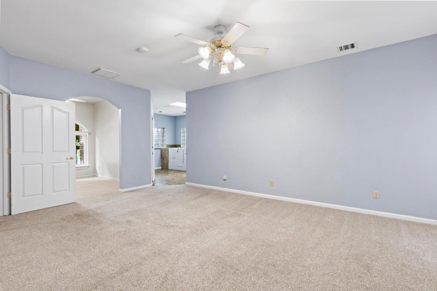 10963 Metteer Road Live Oak, CA 95953 - Photo 18 of 73 a view of an empty room with a ceiling fan