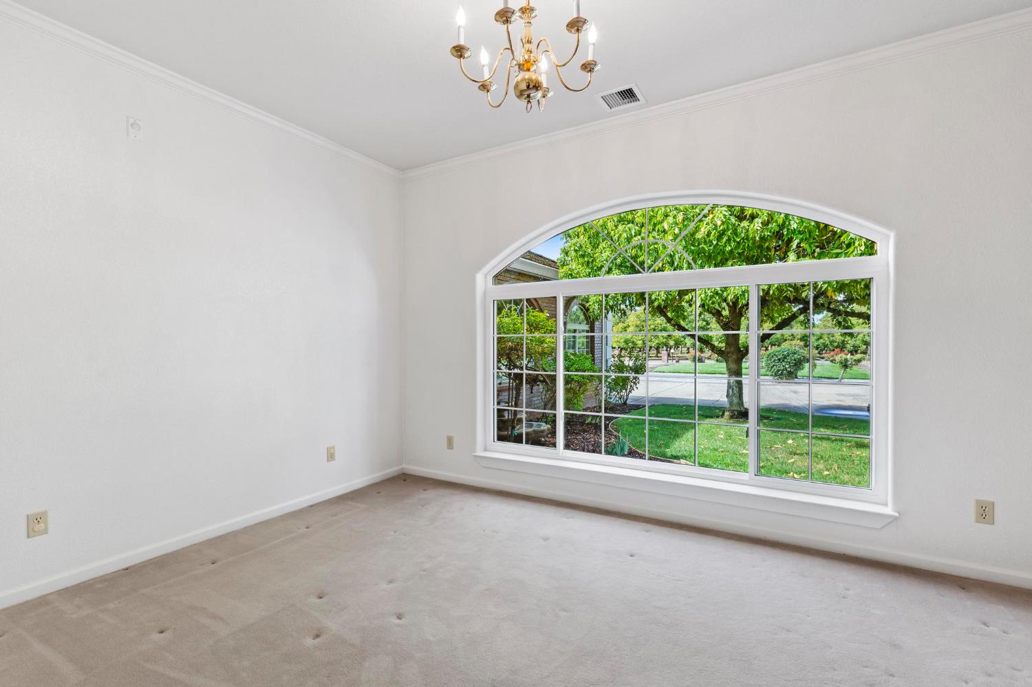 10963 Metteer Road Live Oak, CA 95953 - Photo 25 of 73 an empty room with a window and a fan