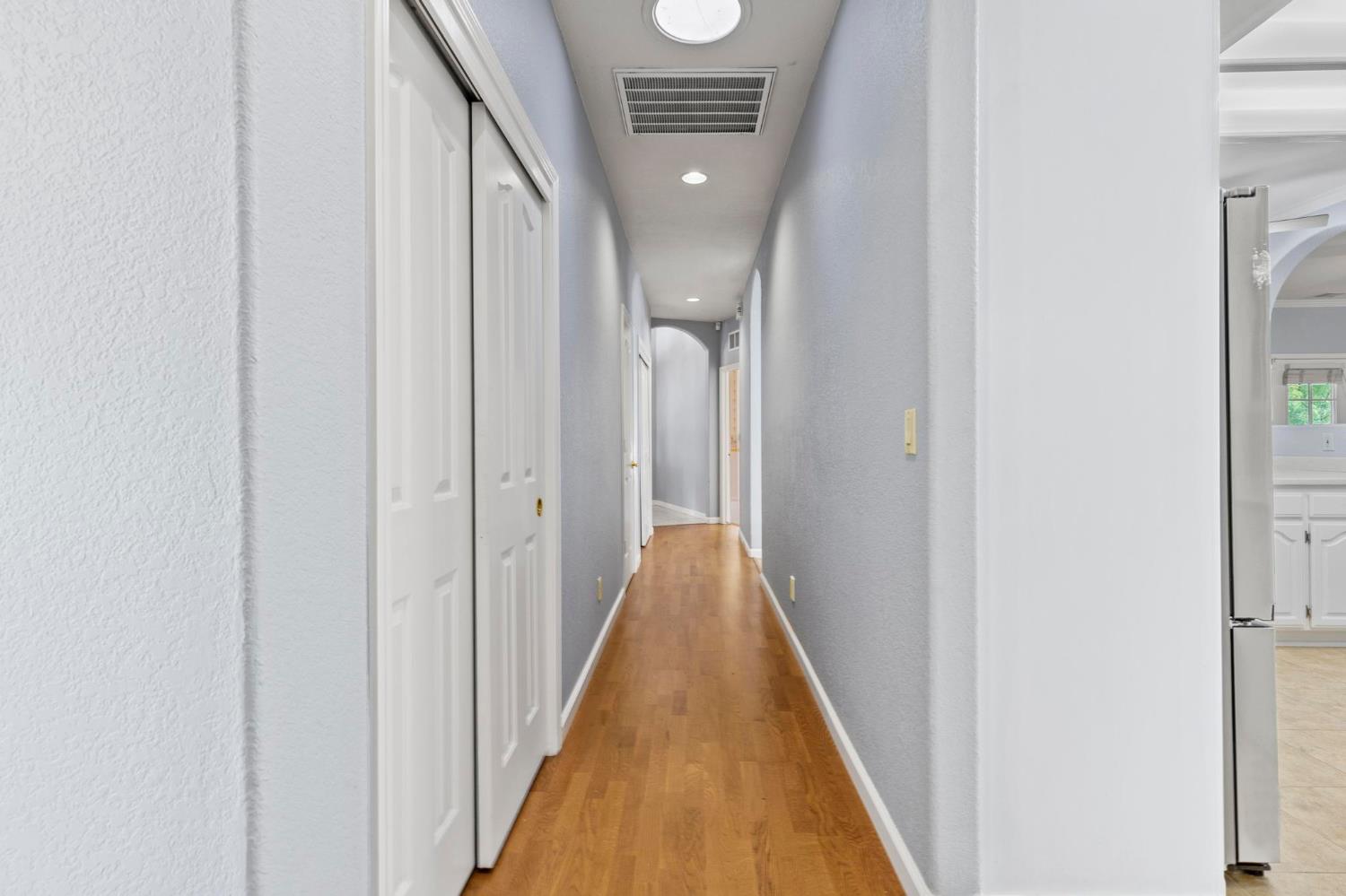 10963 Metteer Road Live Oak, CA 95953 - Photo 27 of 73 a view of a hallway with wooden floor and staircase