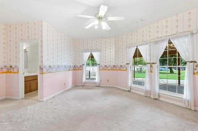 a kitchen with a sink a refrigerator and cabinets