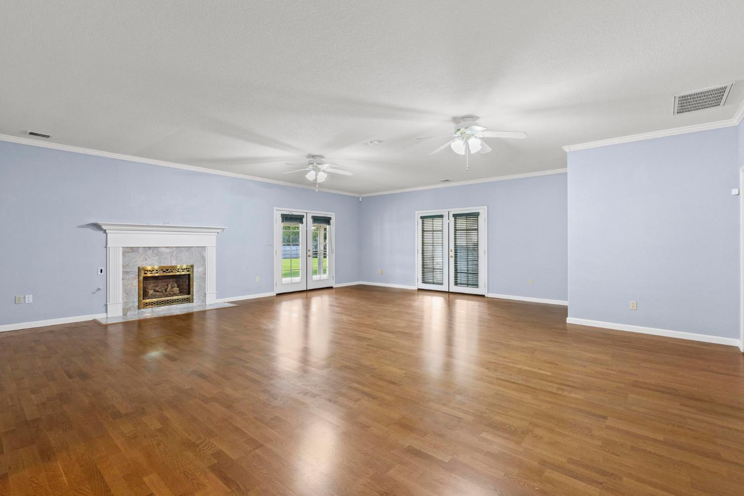 10963 Metteer Road Live Oak, CA 95953 - Photo 32 of 73 a view of an empty room with window and wooden floor