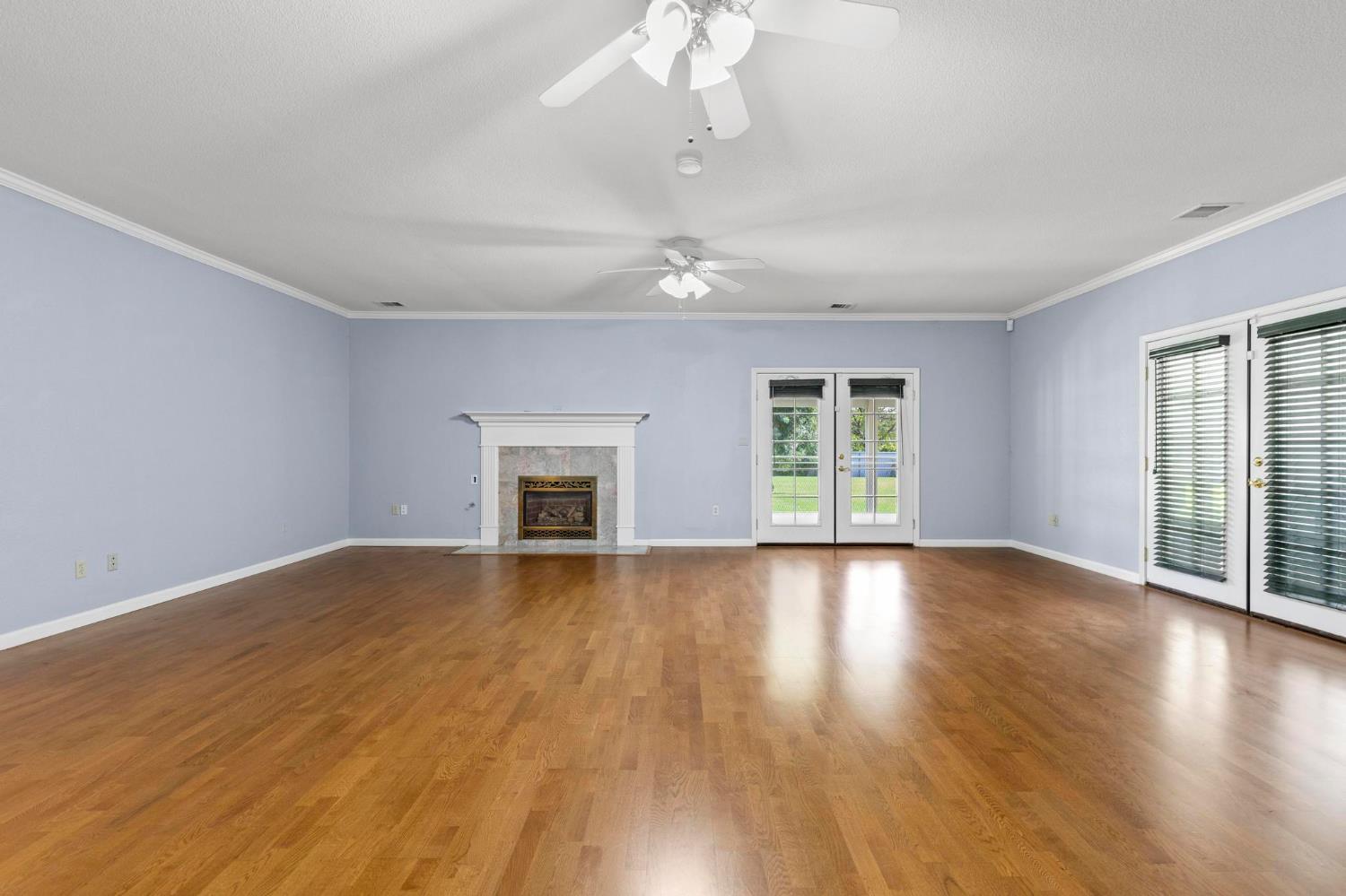 10963 Metteer Road Live Oak, CA 95953 - Photo 33 of 73 a view of an empty room with wooden floor and a window