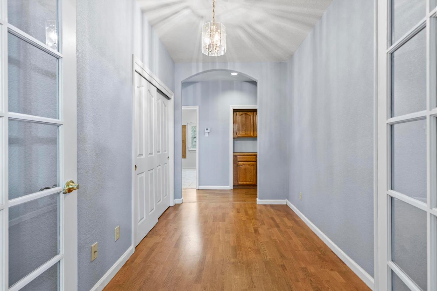 10963 Metteer Road Live Oak, CA 95953 - Photo 37 of 73 a view of a hallway with wooden floor