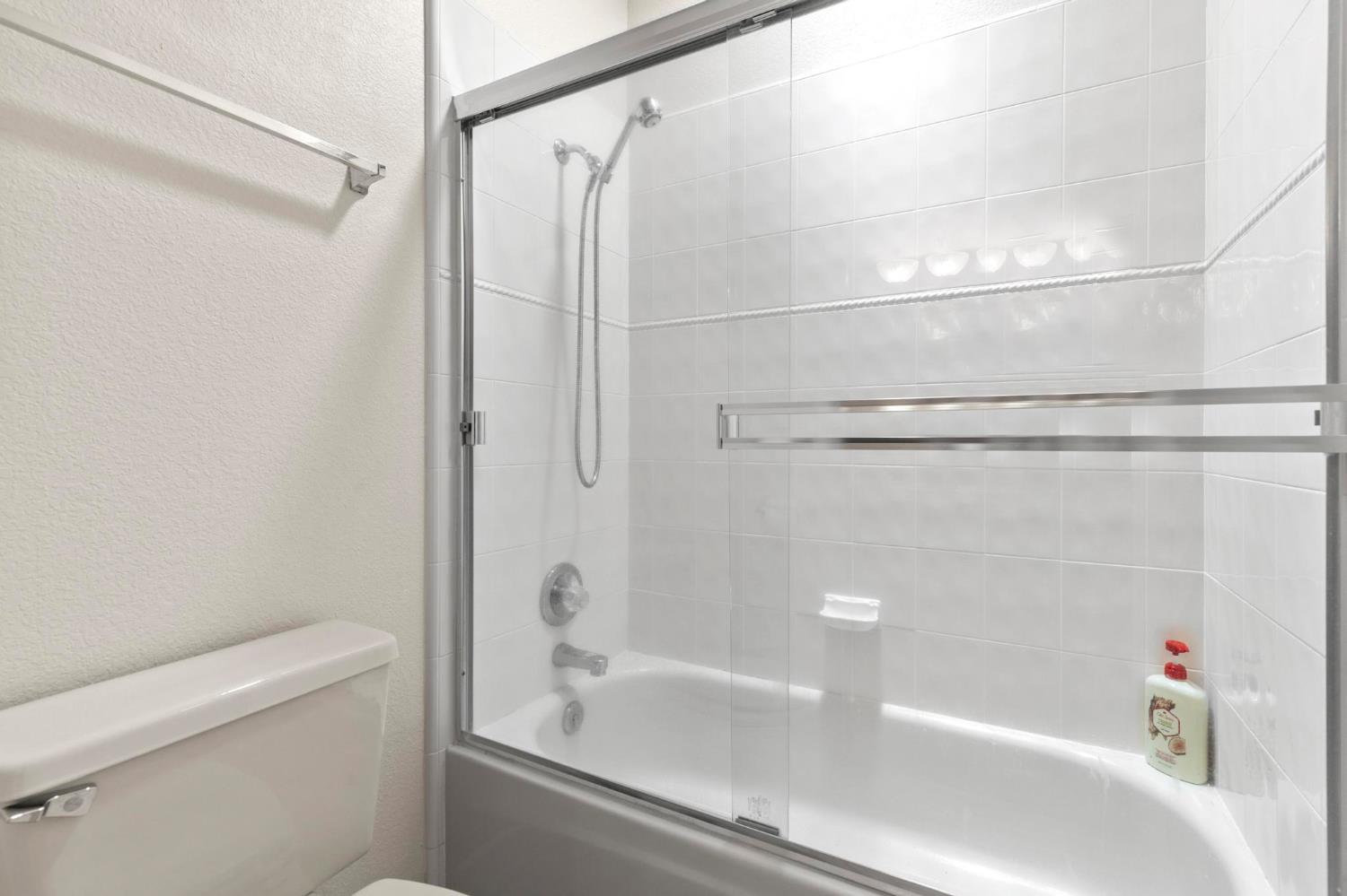 10963 Metteer Road Live Oak, CA 95953 - Photo 46 of 73 a bathroom with a bathtub and a shower