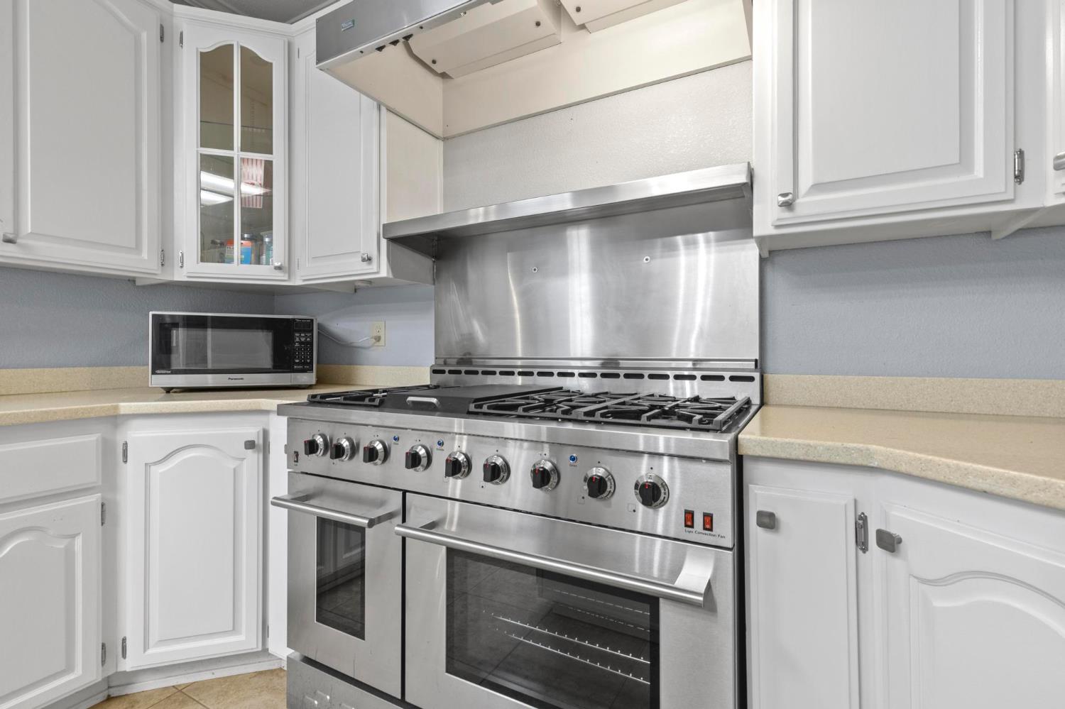 10963 Metteer Road Live Oak, CA 95953 - Photo 54 of 73 a white stove top oven sitting inside of a kitchen