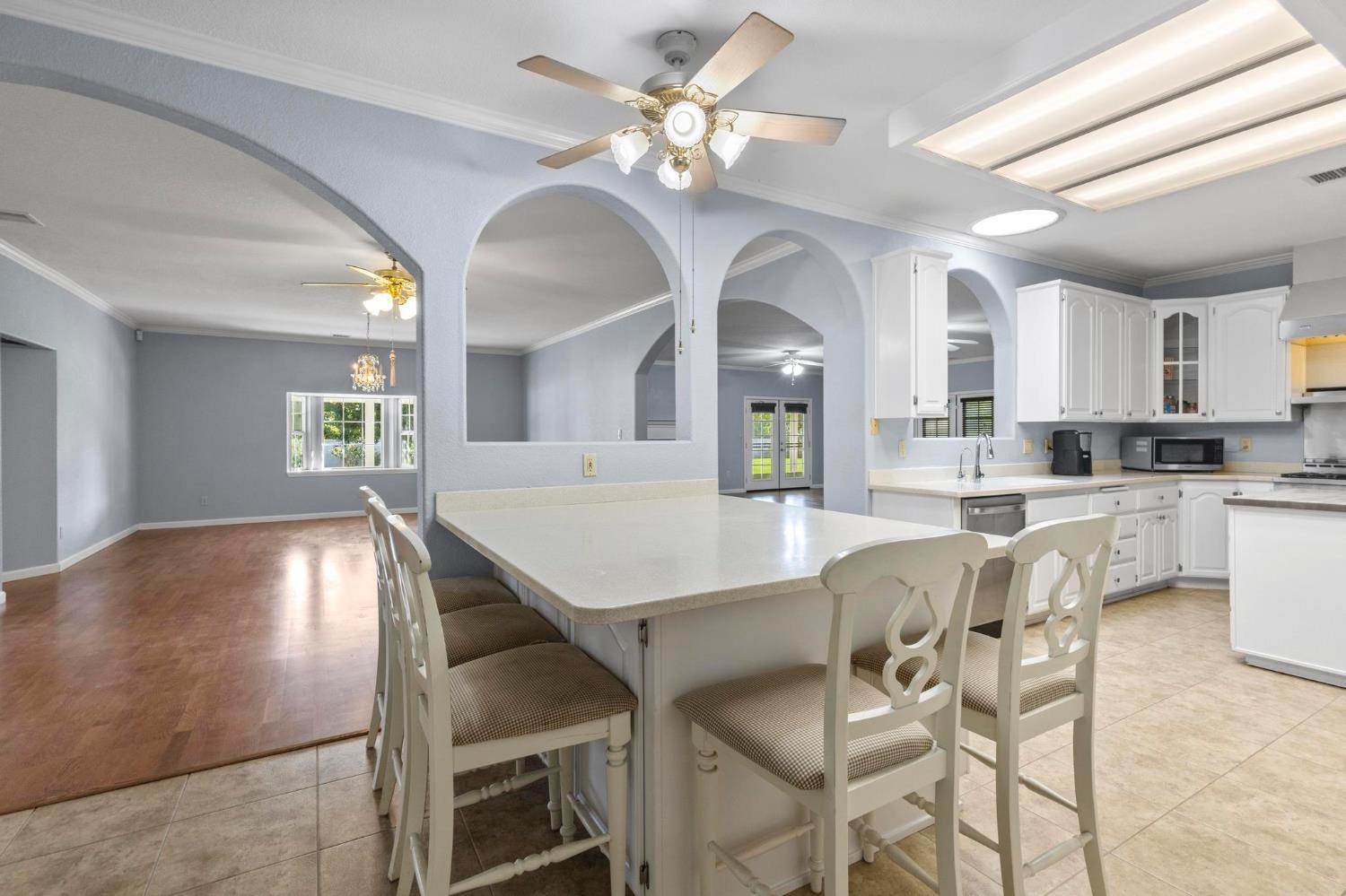 10963 Metteer Road Live Oak, CA 95953 - Photo 56 of 73 a view of a dining room with furniture and a chandelier fan