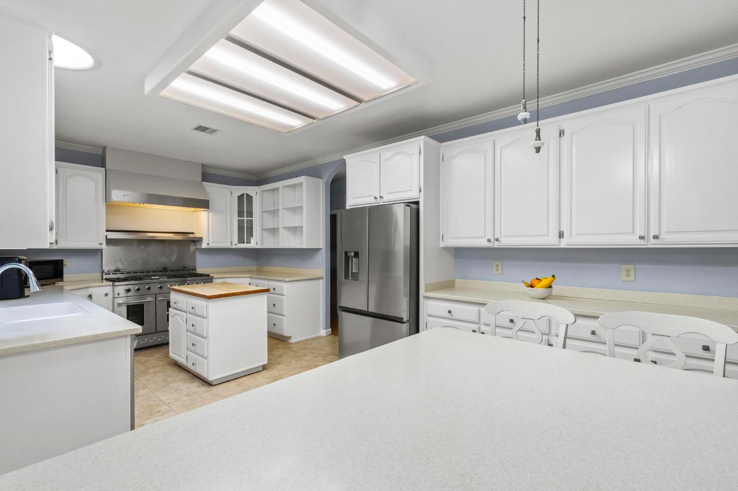 10963 Metteer Road Live Oak, CA 95953 - Photo 58 of 73 a kitchen with refrigerator and cabinets