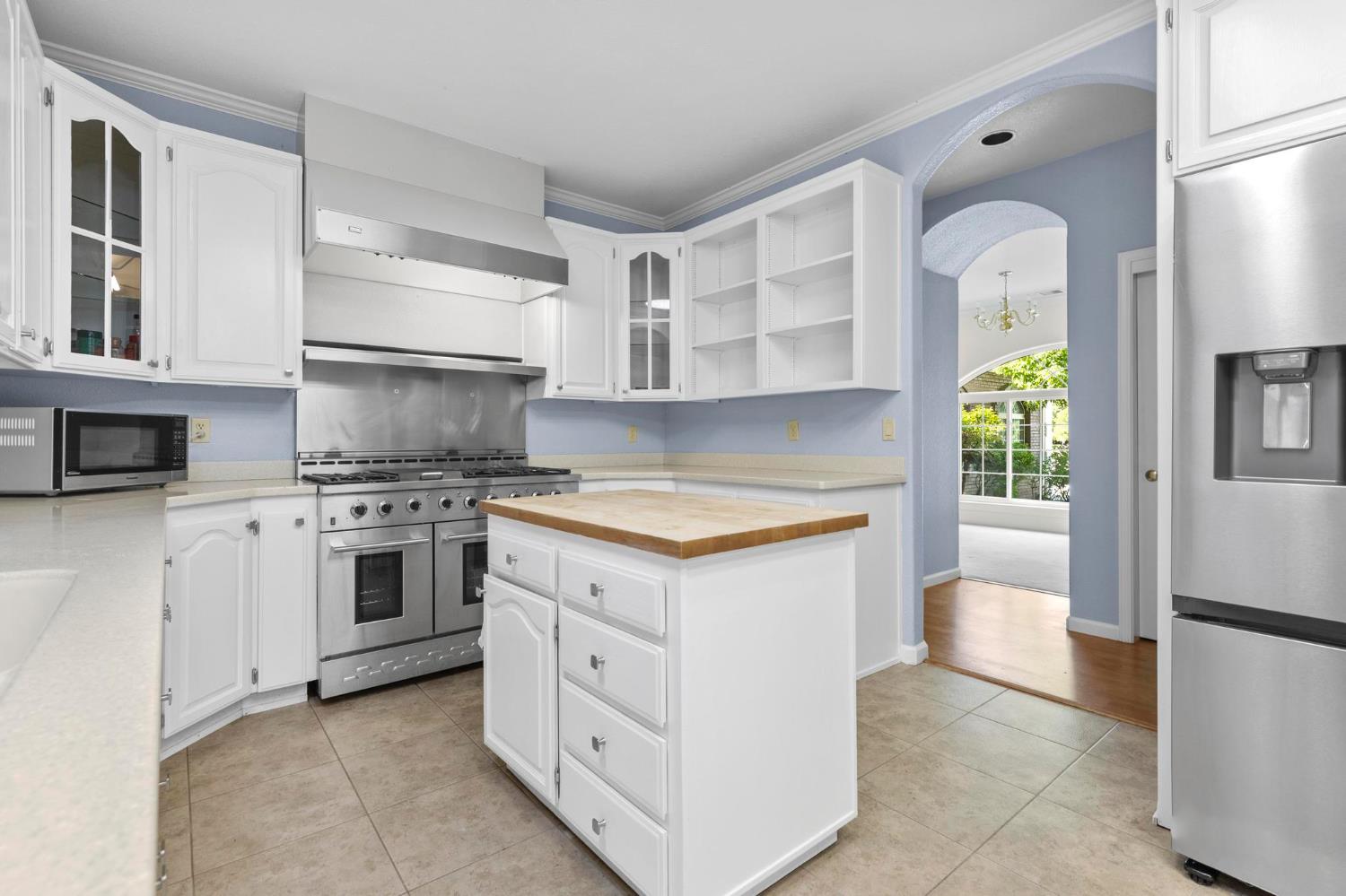 10963 Metteer Road Live Oak, CA 95953 - Photo 59 of 73 a kitchen with white cabinets and appliances