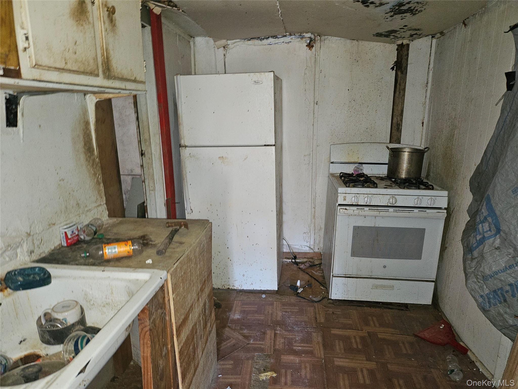 549 Granny Road Medford, NY 11763 - Photo 19 of 37 a kitchen with sink a stove and refrigerator