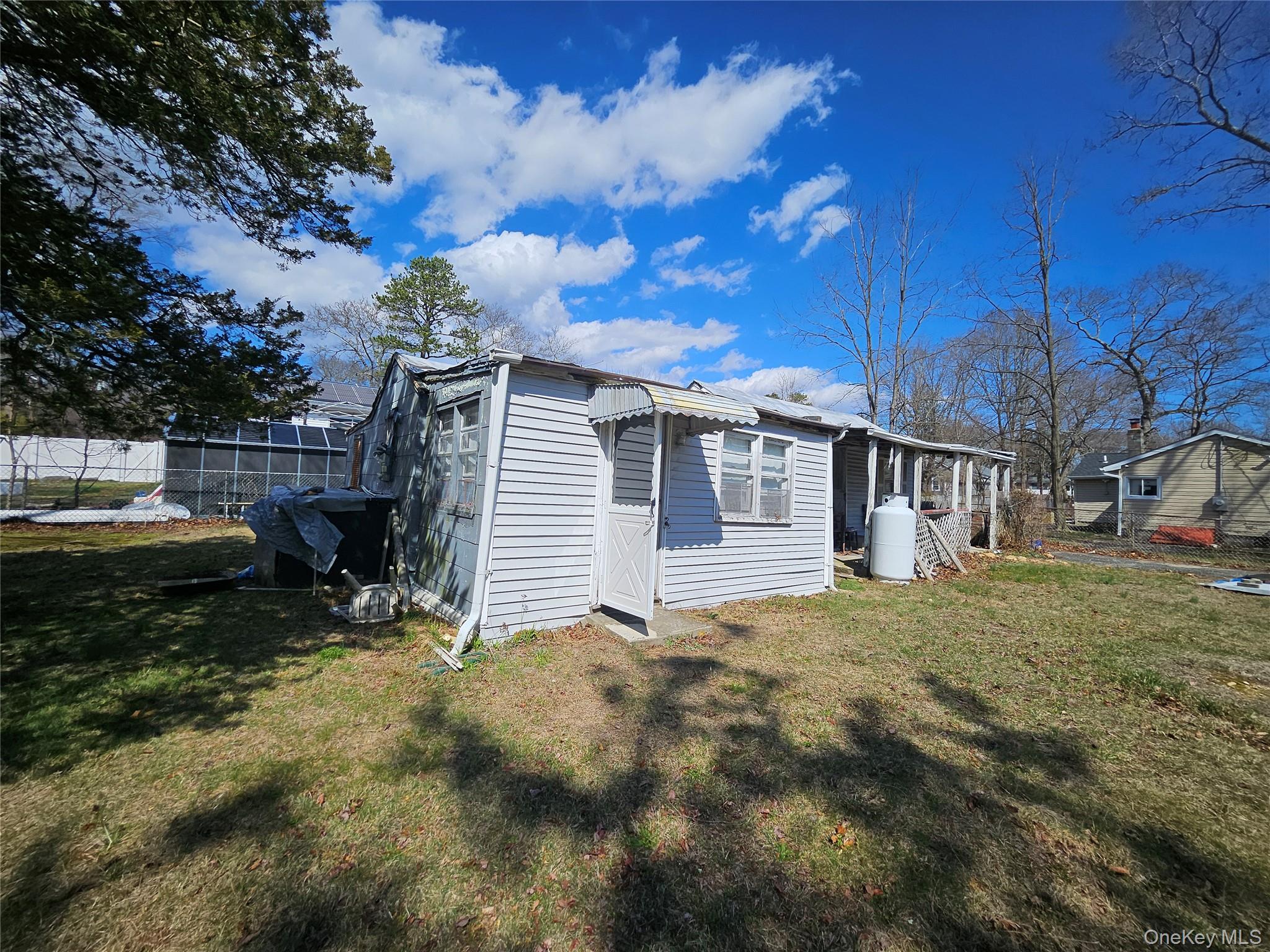 549 Granny Road Medford, NY 11763 - Photo 24 of 37 a view of a house with a yard
