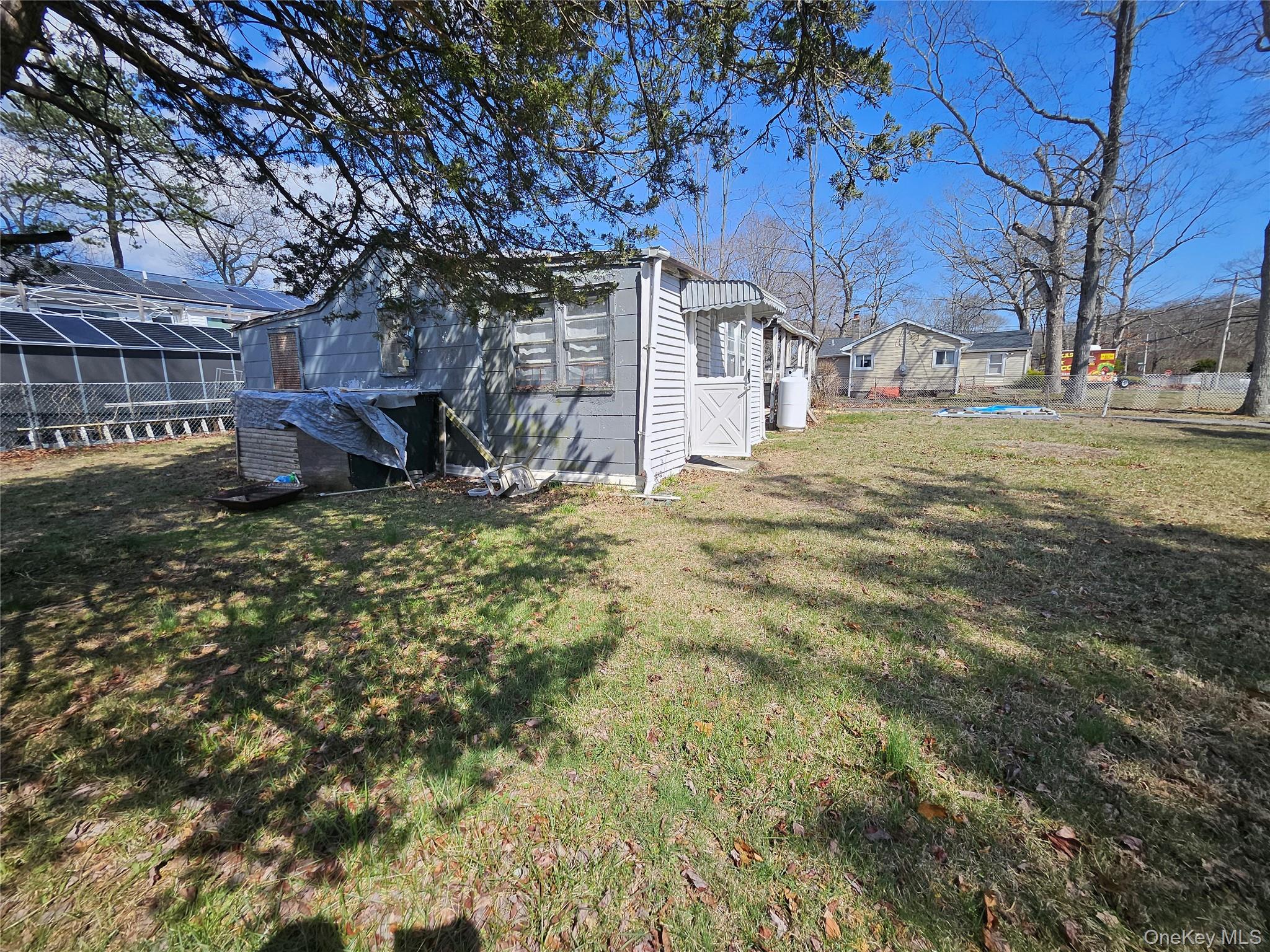 549 Granny Road Medford, NY 11763 - Photo 3 of 37 a view of a outdoor space with a tree