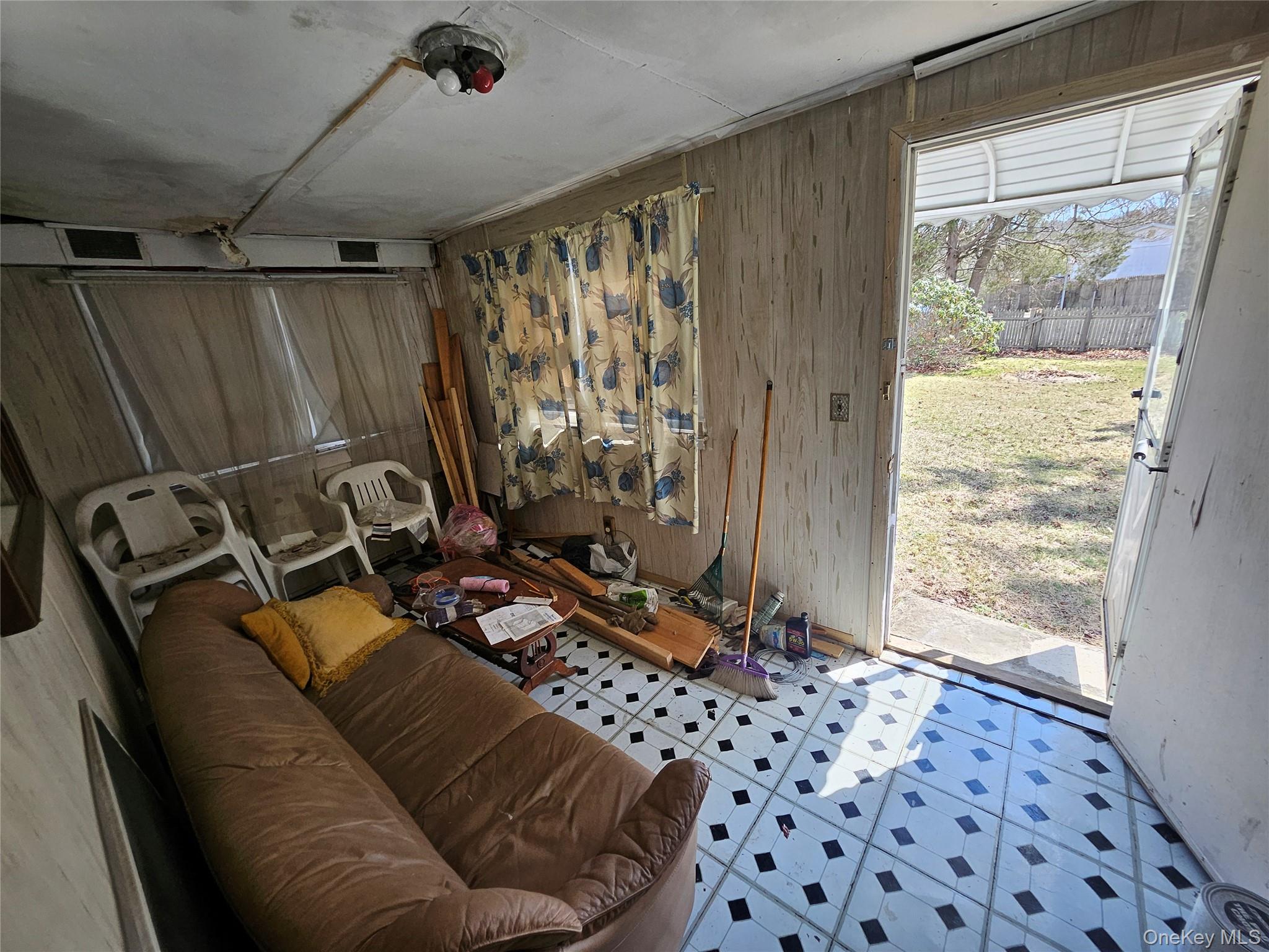 549 Granny Road Medford, NY 11763 - Photo 31 of 37 a living room with furniture and a window