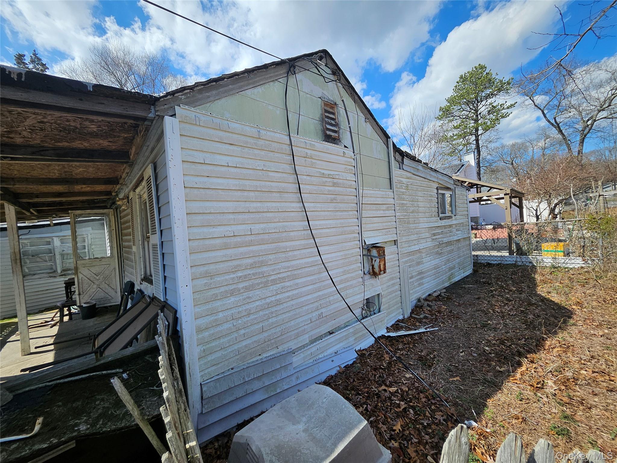 549 Granny Road Medford, NY 11763 - Photo 32 of 37 a view of a house with a yard