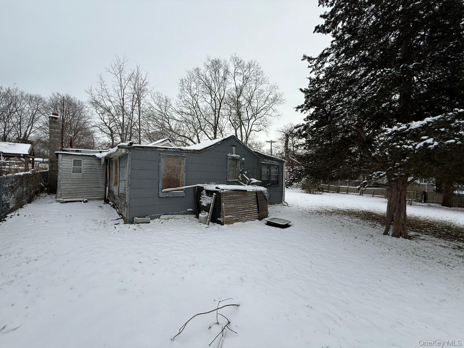 549 Granny Road Medford, NY 11763 - Photo 35 of 37 a view of a house with a snow in the yard