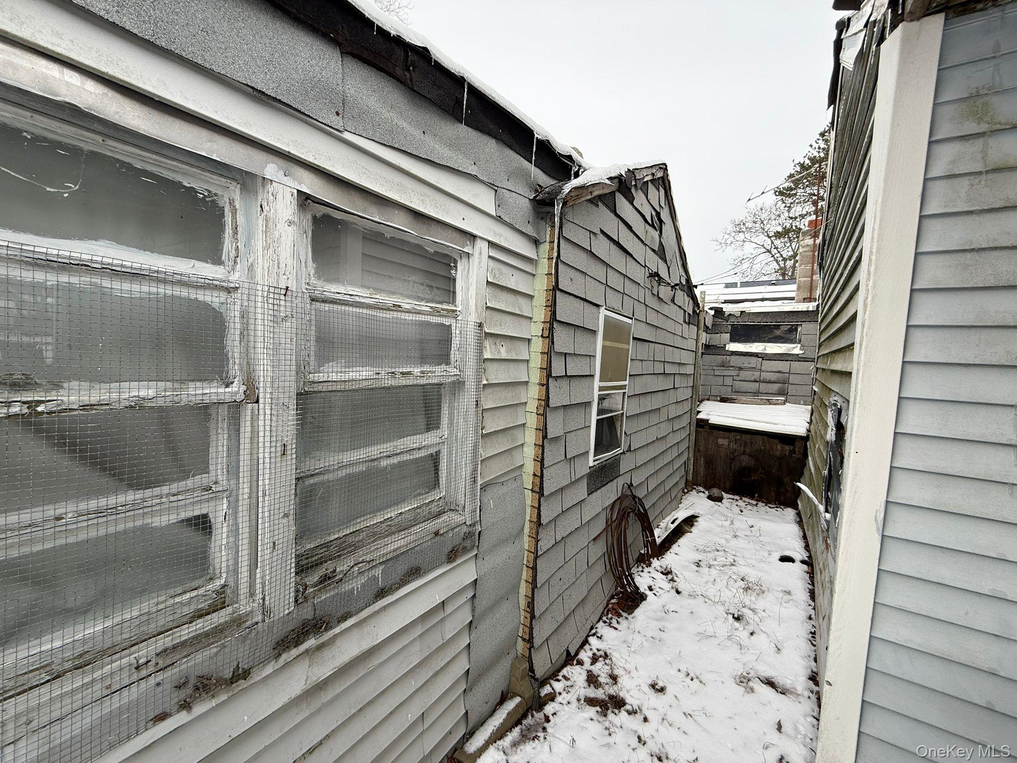 549 Granny Road Medford, NY 11763 - Photo 36 of 37 a bathroom with a toilet and a shower