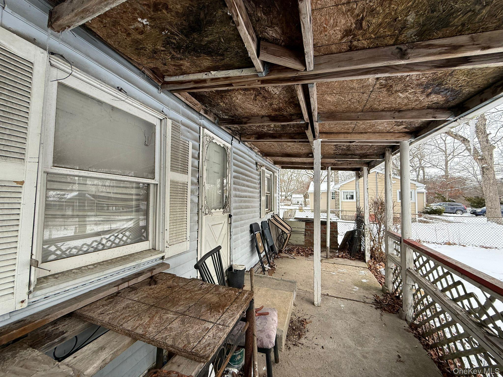 549 Granny Road Medford, NY 11763 - Photo 37 of 37 a view of a porch with furniture and a yard