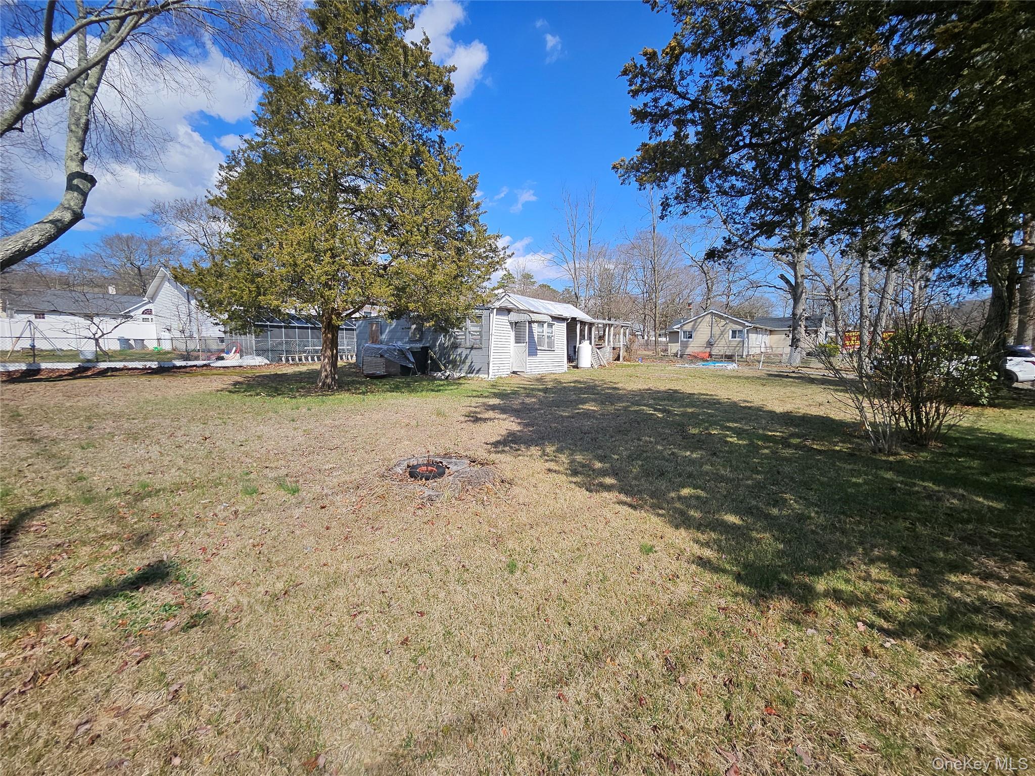 549 Granny Road Medford, NY 11763 - Photo 5 of 37 a view of a yard with a tree
