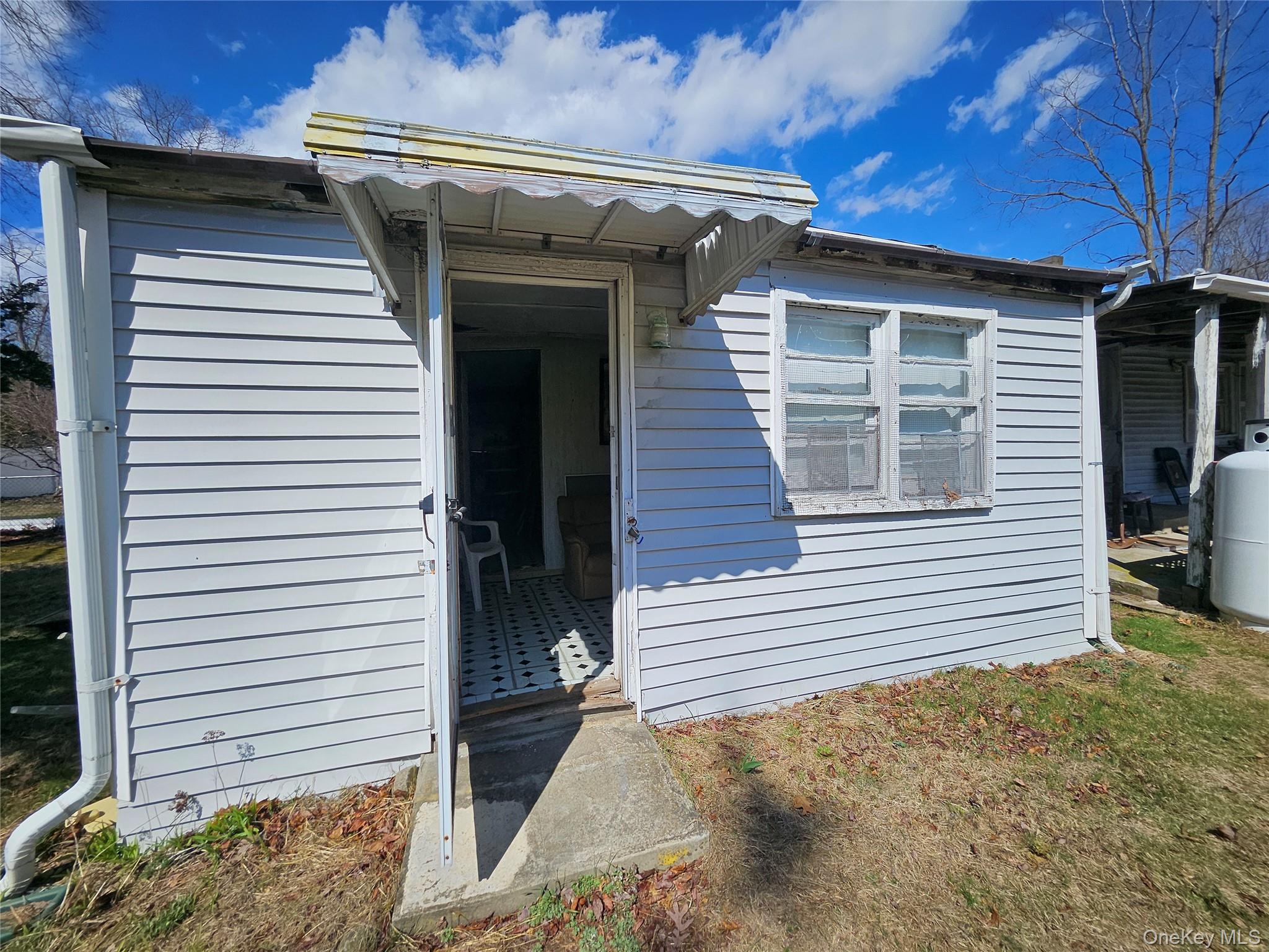549 Granny Road Medford, NY 11763 - Photo 6 of 37 a view of a house with a garage