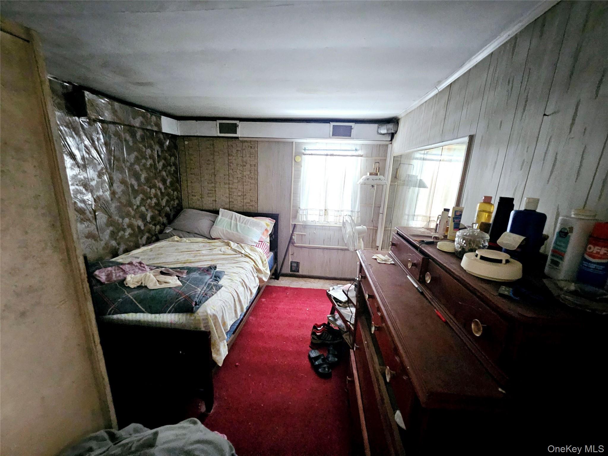 549 Granny Road Medford, NY 11763 - Photo 8 of 37 a bedroom with a bed and wooden floor