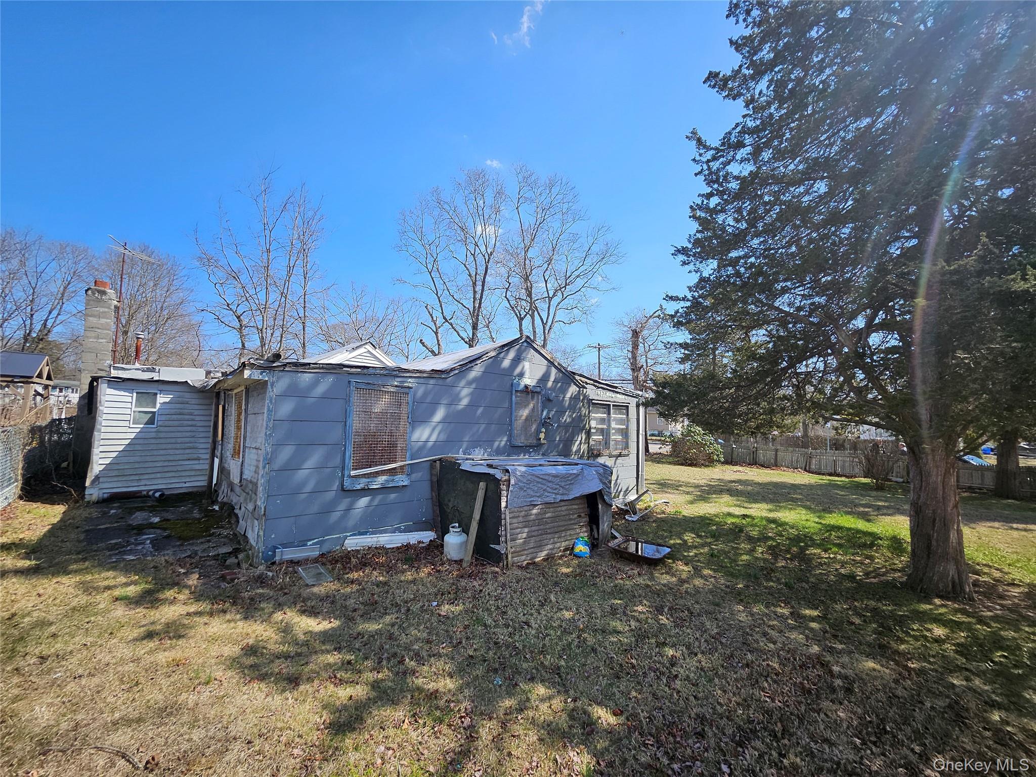 549 Granny Road Medford, NY 11763 - Photo 9 of 37 a view of a barn in the middle of a yard