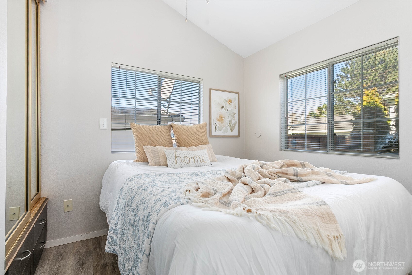 4751 Birch Bay Lynden Road, Unit 129 Blaine, WA 98230 - Photo 11 of 34 a bedroom with a large bed and a large window