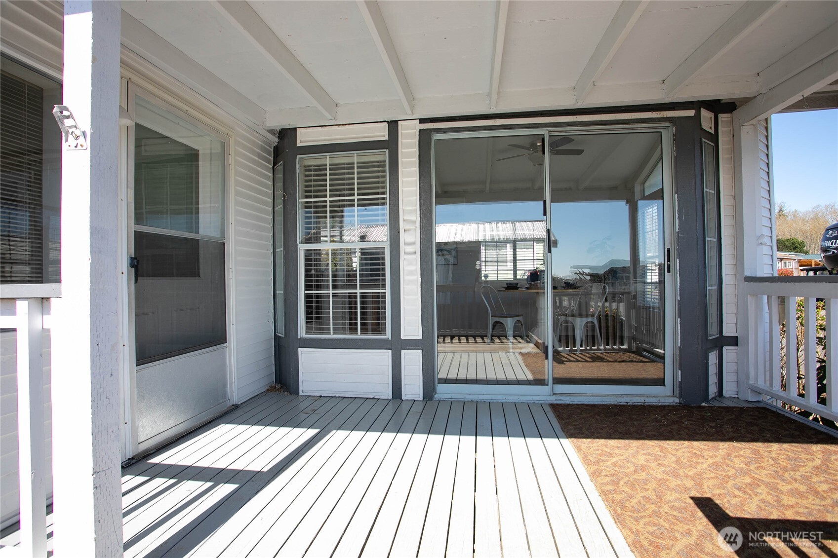 4751 Birch Bay Lynden Road, Unit 129 Blaine, WA 98230 - Photo 19 of 34 a view of a balcony with a floor to ceiling window