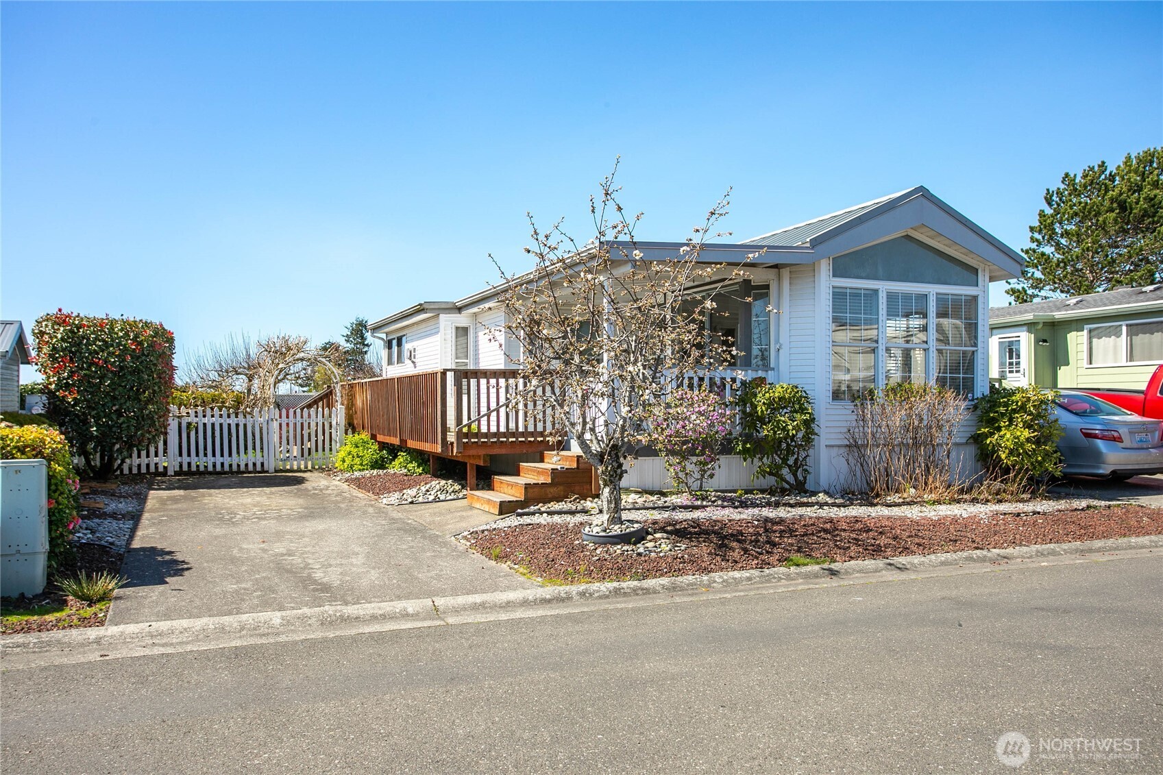 4751 Birch Bay Lynden Road, Unit 129 Blaine, WA 98230 - Photo 2 of 34 a view of a house with sitting area and chandelier next to a road