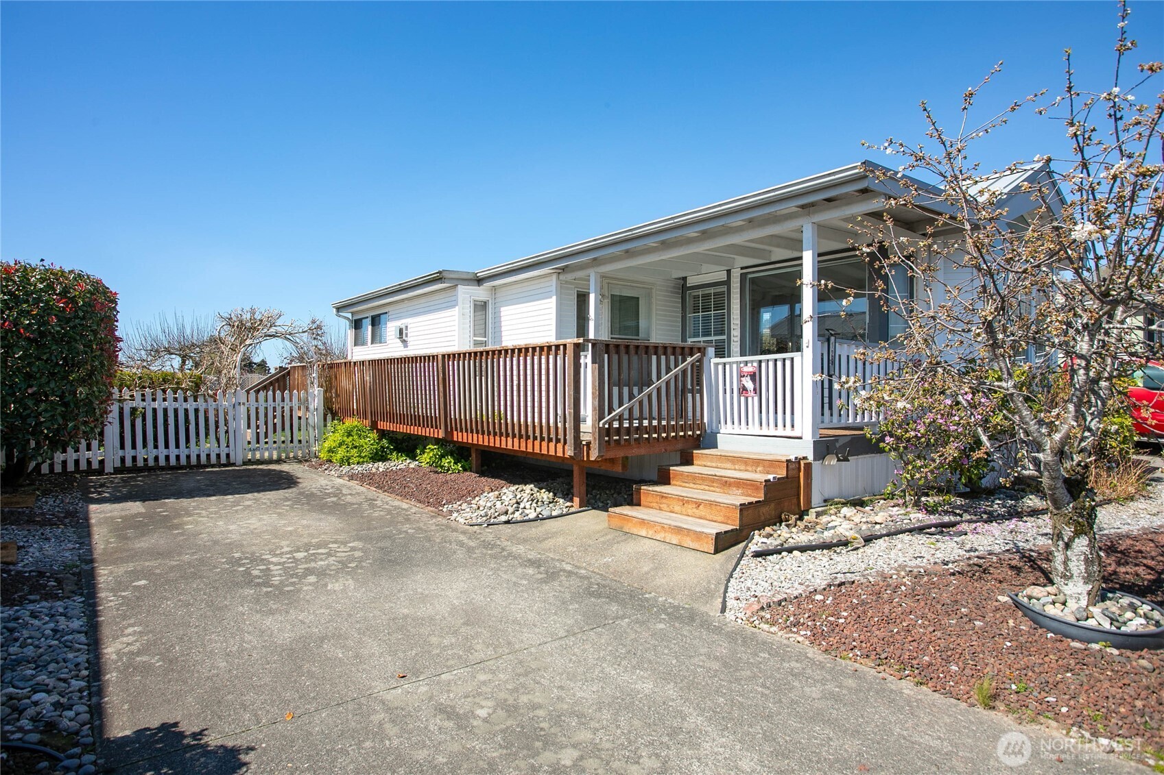4751 Birch Bay Lynden Road, Unit 129 Blaine, WA 98230 - Photo 3 of 34 a view of a house with a yard and wooden fence