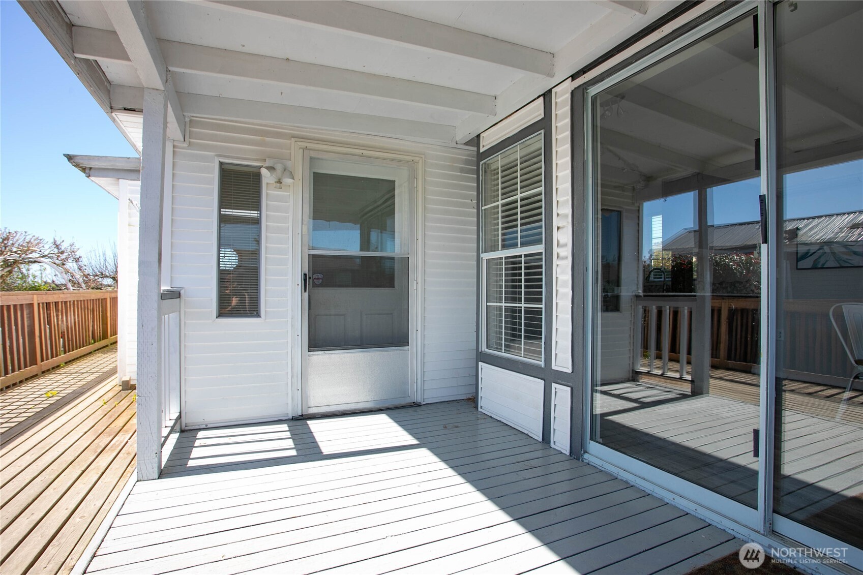4751 Birch Bay Lynden Road, Unit 129 Blaine, WA 98230 - Photo 4 of 34 a view of a balcony with wooden floor