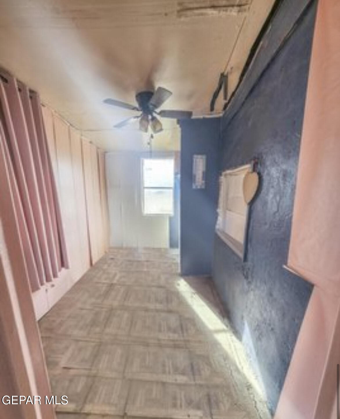 12320 Argentite Street Clint, TX 79836 - Photo 4 of 10 a view of a hallway to a house with wooden floor and stairs