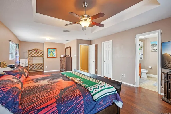 a bed room with a bed and a chandelier