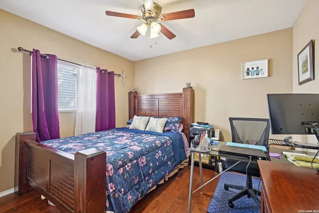 a bedroom with a bed and a desk