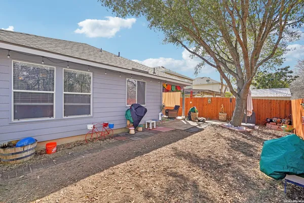 a backyard of a house with seating space
