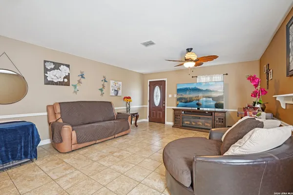 a living room with furniture and a flat screen tv