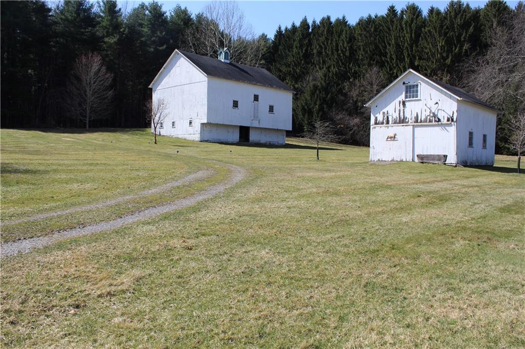 1820 Stoughton Road Slippery Rock, PA 16057 - Photo 5 of 24 a large house with a big yard and large trees
