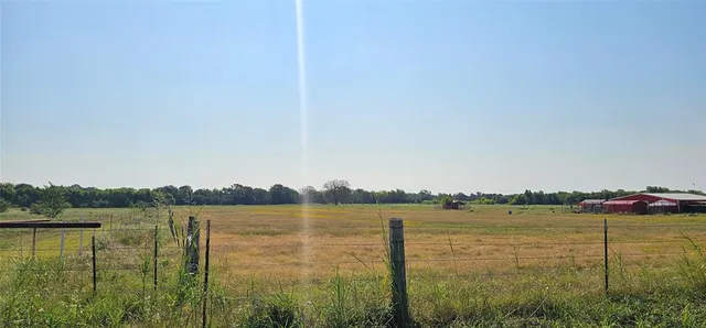 a view of lake with green space