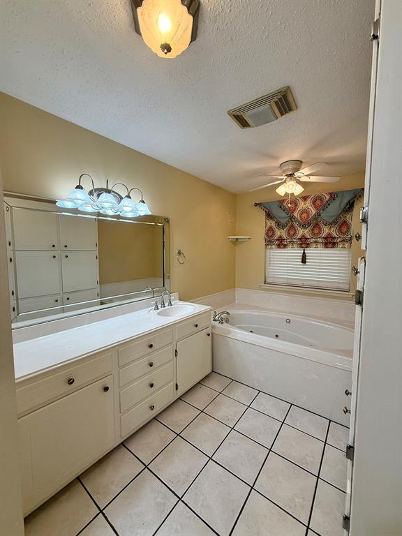 11535 Timber Ridge Drive Keithville, LA 71047 - Photo 14 of 39 a bathroom with a double vanity sink mirror and bathtub