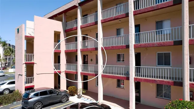 a view of a balcony with wooden floor